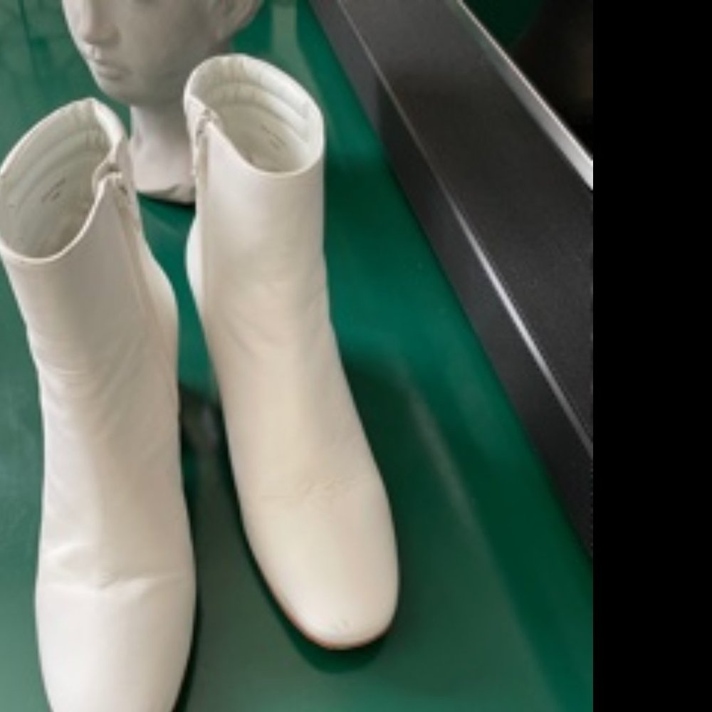 Sleek white leather ankle boots